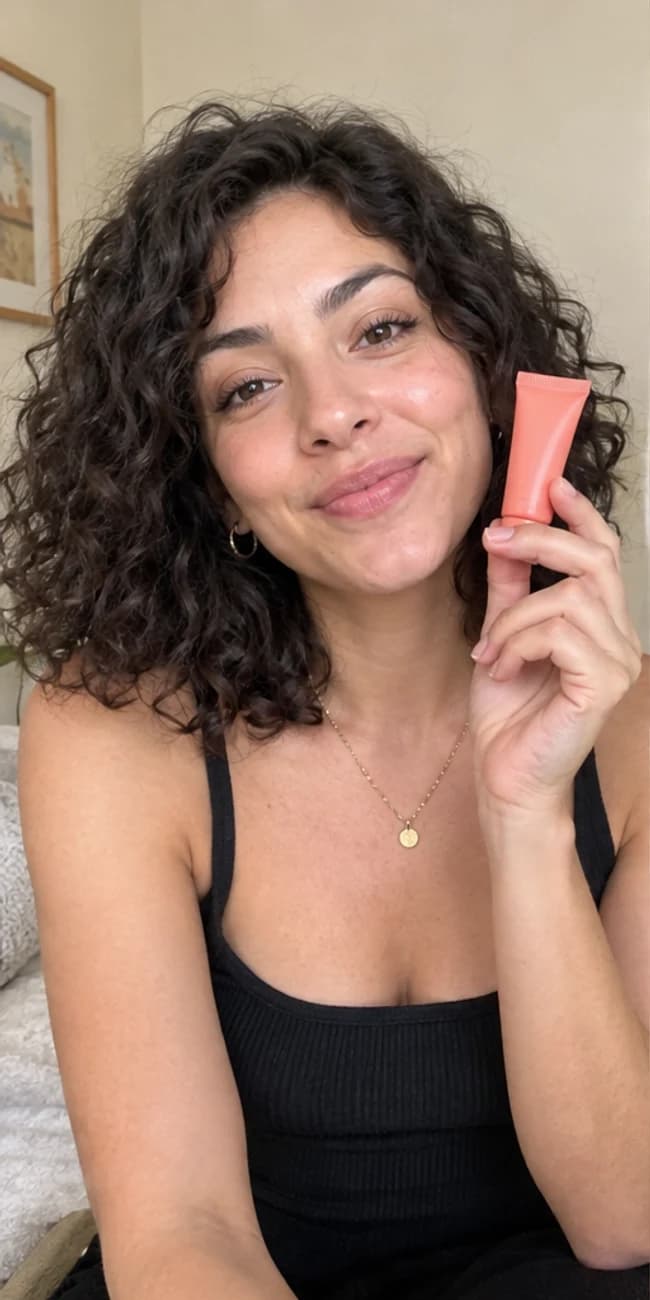 AI-generated image of a creator holding an unbranded coral skincare tube